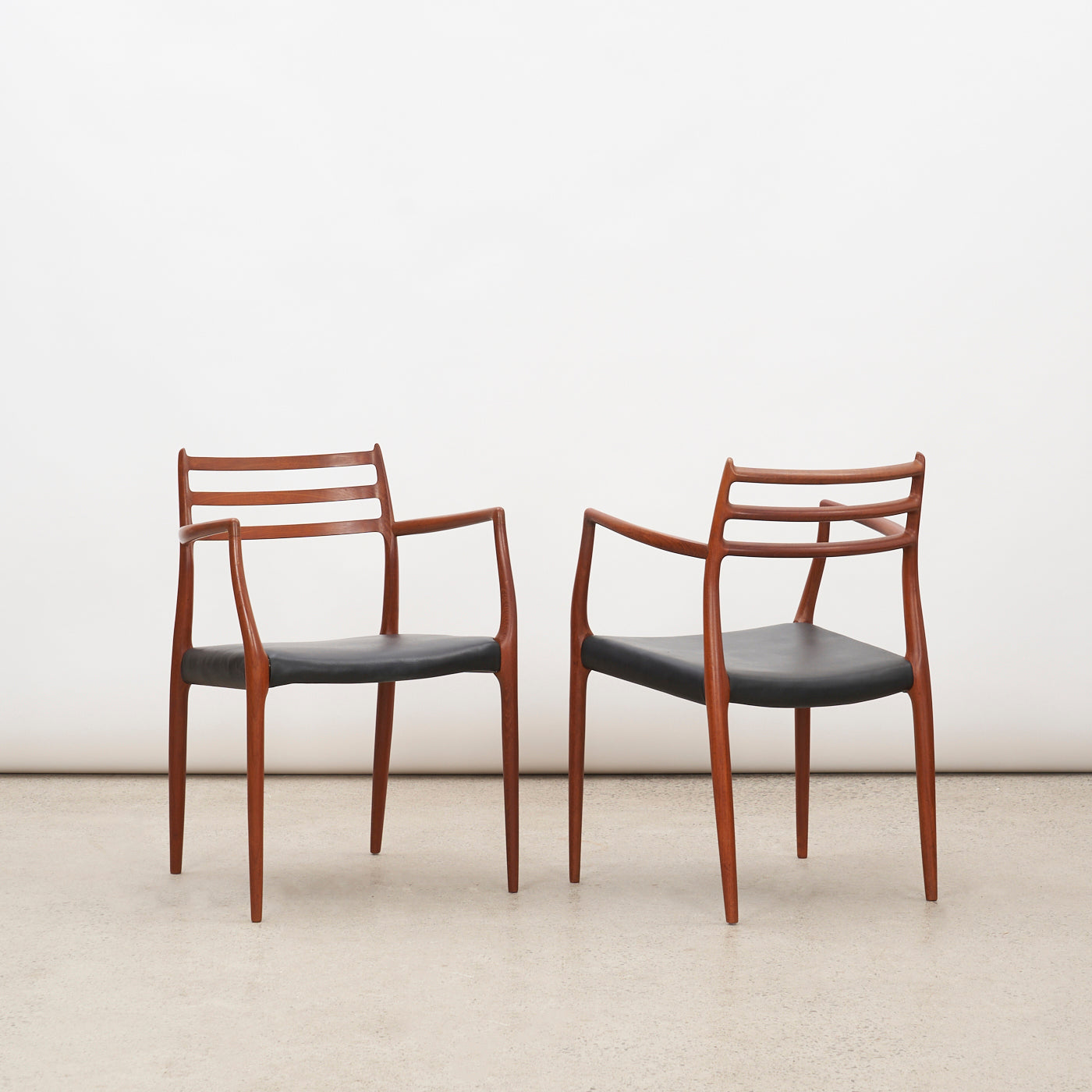 Pair of Teak & Black Leather 'Model 62' Armchairs by Niels O. Møller for J.L. Møller, Denmark