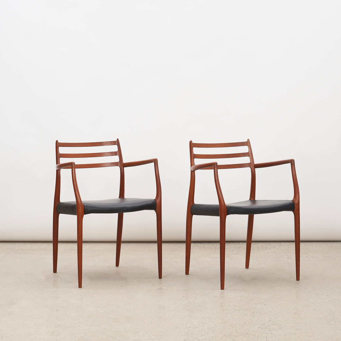 Pair of Teak & Black Leather 'Model 62' Armchairs by Niels O. Møller for J.L. Møller, Denmark