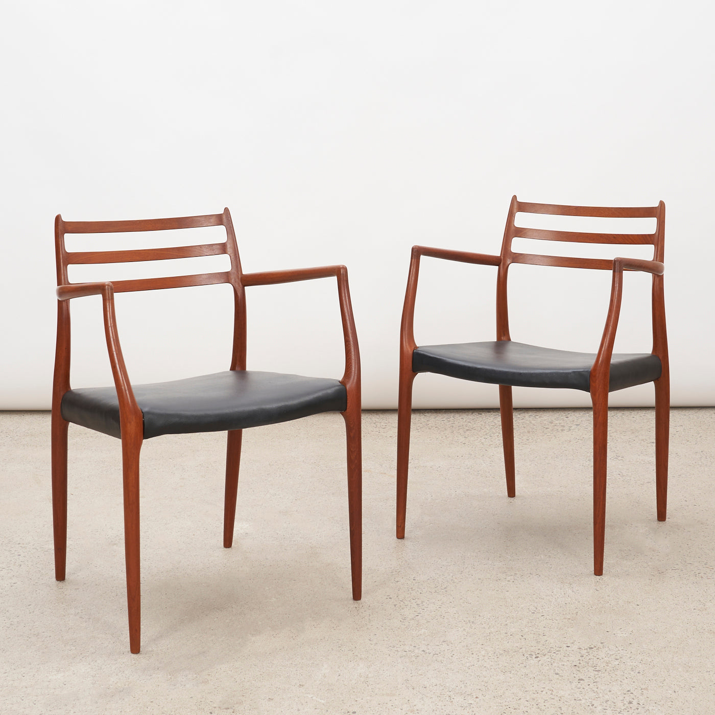 Pair of Teak & Black Leather 'Model 62' Armchairs by Niels O. Møller for J.L. Møller, Denmark