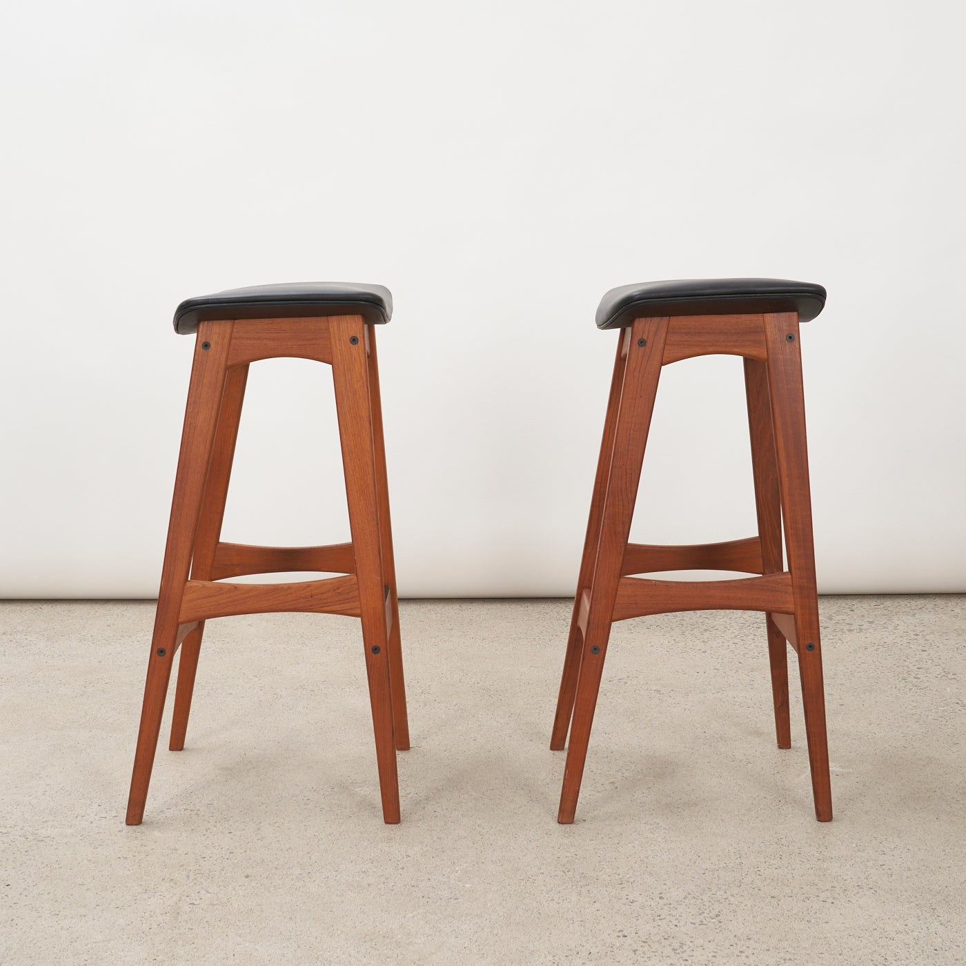 Pair of Teak & Black Vinyl Bar Stools by Johannes Andersen for Brdr. Andersens Møbelfabrik, Denmark