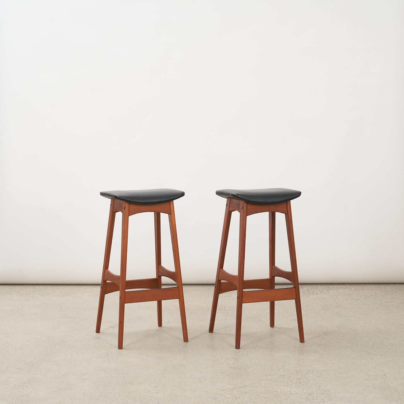 Pair of Teak & Black Vinyl Bar Stools by Johannes Andersen for Brdr. Andersens Møbelfabrik, Denmark