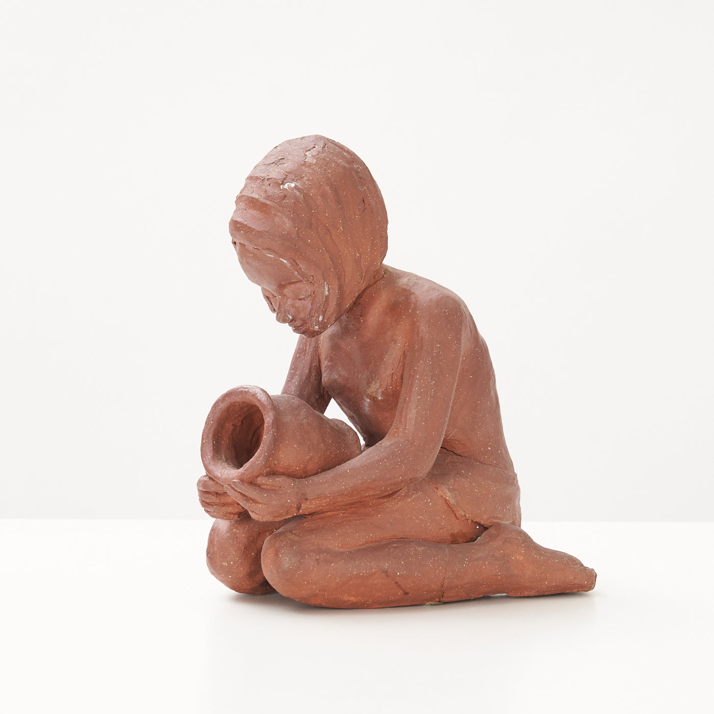 Red Clay Kneeling Child Figurine