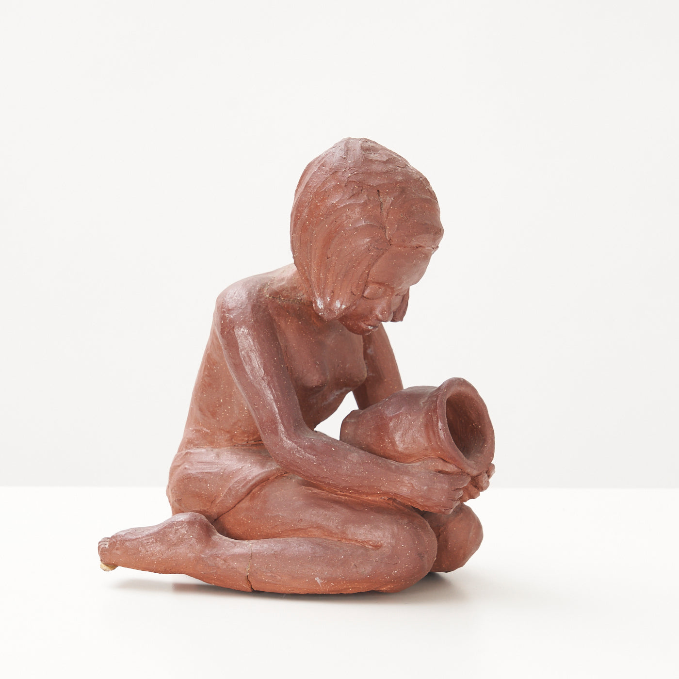 Red Clay Kneeling Child Figurine