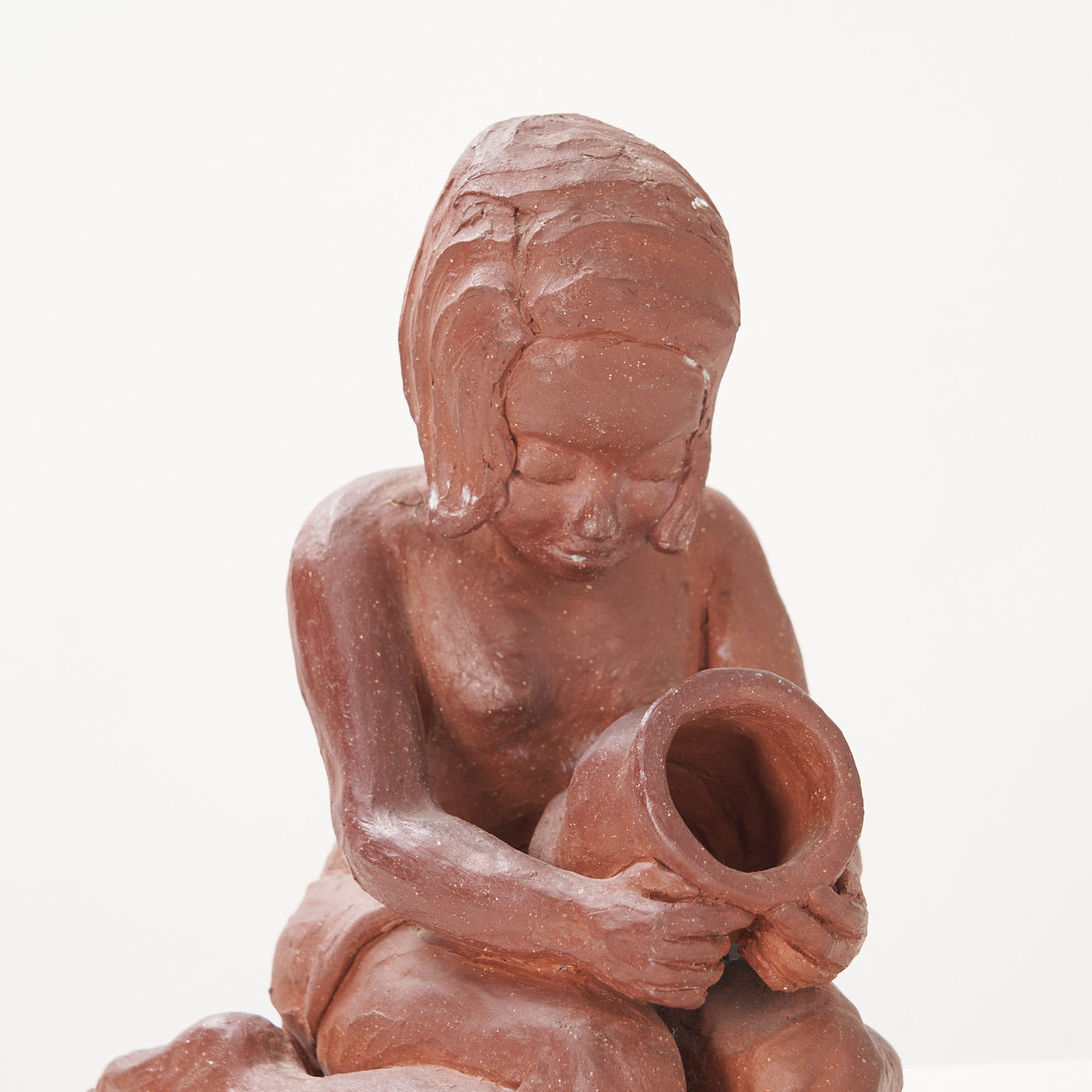 Red Clay Kneeling Child Figurine